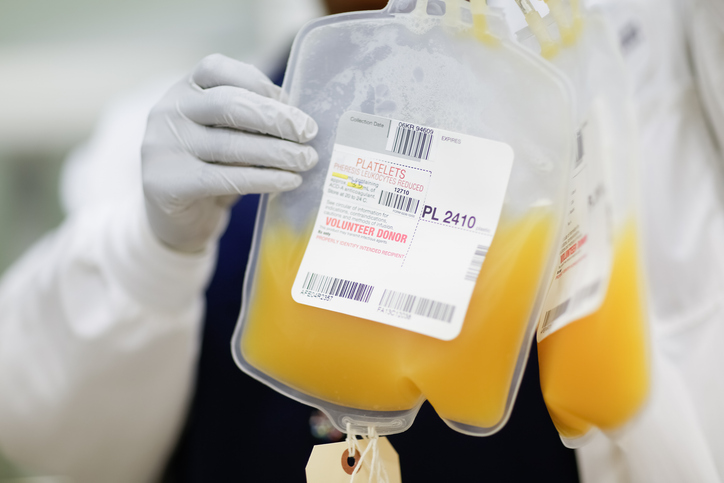 Photo shows an unidentified person holding up a donor's platelet donation at a public blood drive in Torrance, California/Getty Images