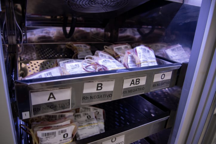 Photo shows bags of various blood types sitting in a storage container/Getty Images