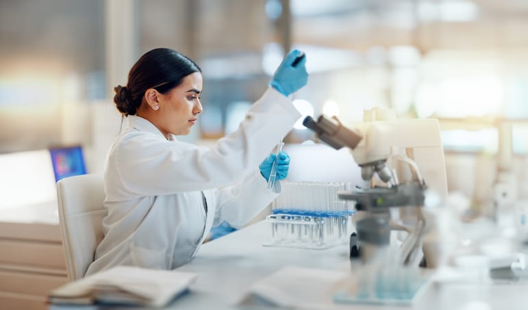 Photo shows a researcher working in a laboratory/Getty Images