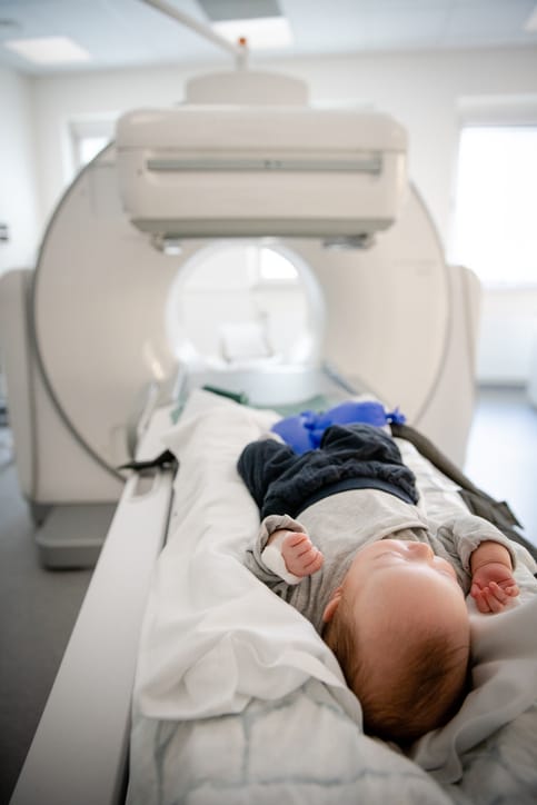 Photo shows an infant about to undergo an MRI/Getty Images