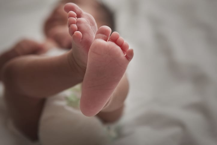 Photo shows a close up of a newborn infant's feet/Getty Images
