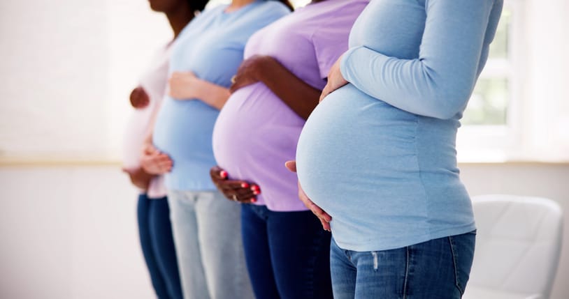 Photo shows four pregnant women standing in a row/Getty Images