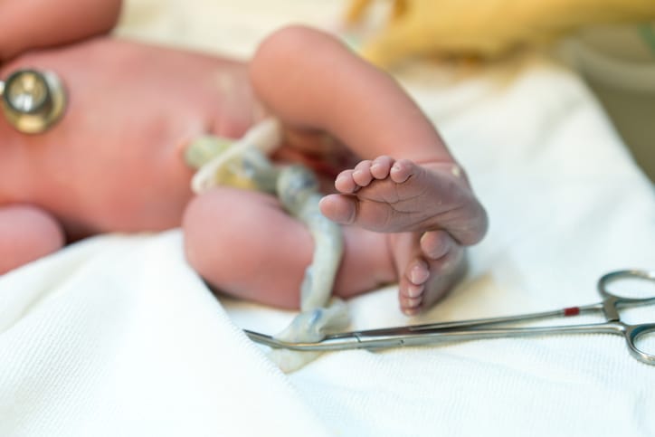 Photo shows a newborn baby where the focus is on feet and toes/Getty Images