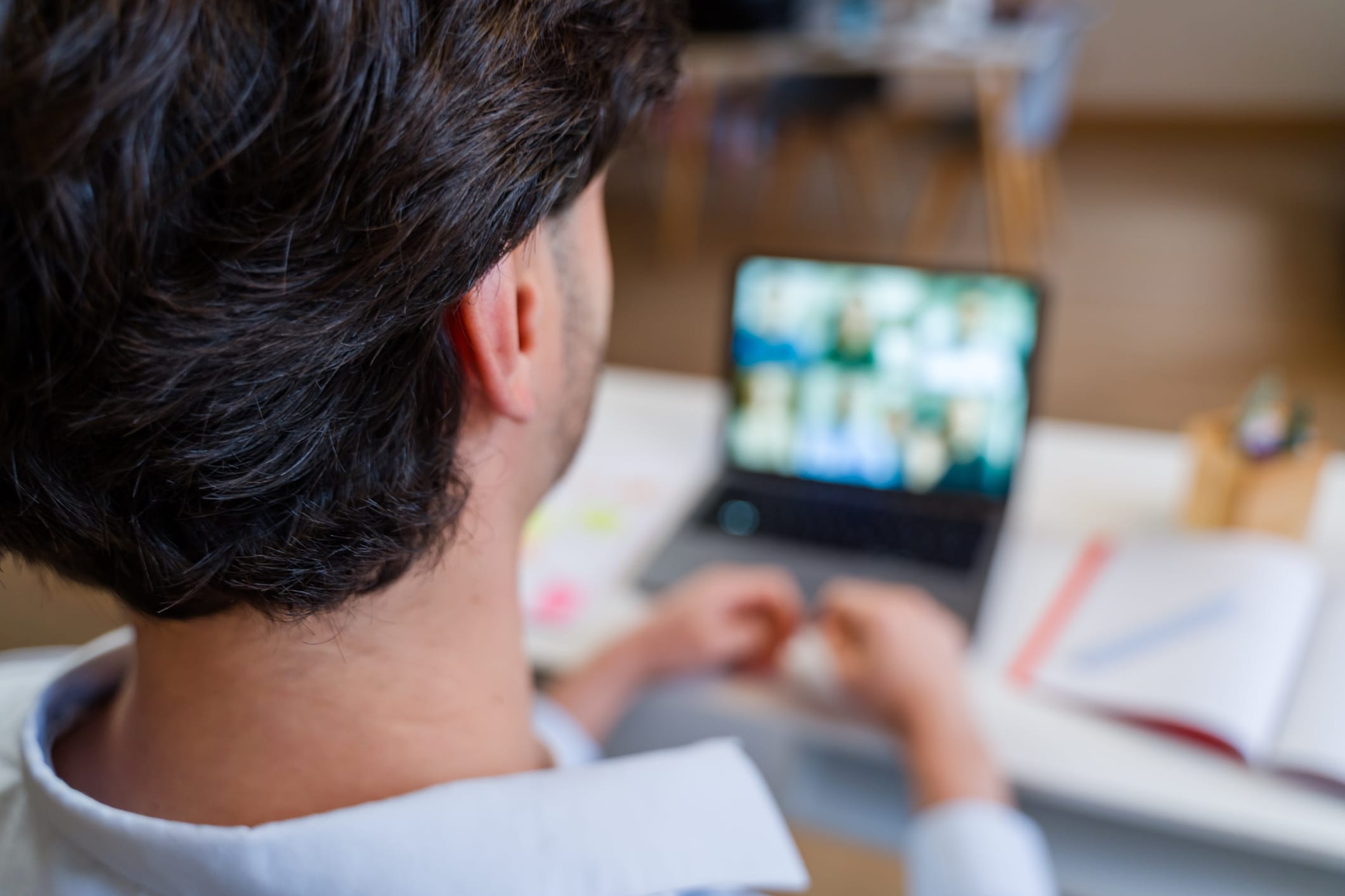 Photo of man in a virtual meeting