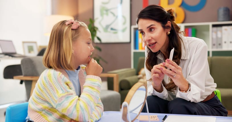 Photo shows a child attending speech therapy/Getty Images