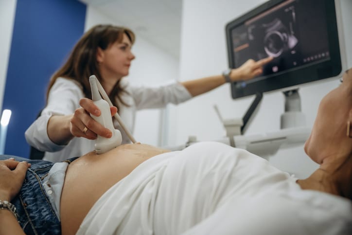 Photo shows a pregnant woman receiving an ultrasound/Getty Images